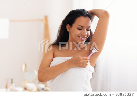 Cheerful Lady Shaving Armpit Hair Using Safety Razor In Bathroom Cheerful Lady Shaving Armpit Hair Using Safety Razor In Bathroom 93985327
