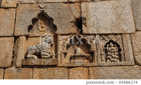 Carved sculpture of Shivalinga and Nandi on the wall of Chitradurga fort, Karnataka, India. Carved sculpture of Shivalinga and Nandi on the wall of Chitradurga fort, Karnataka, India. 93986174