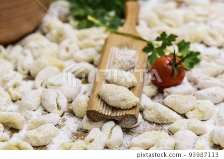 Homemade gnocchi, prepared on the table with ingredients. Homemade gnocchi, prepared on the table with ingredients. 93987113