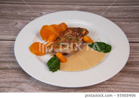 Recipe for baked lamb shoulder with watercress mashed, sweet potato and carrot, pepper sauce, cognac 93988406