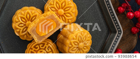 Delicious Cantonese moon cake for Mid-Autumn Festival food mooncake on blue table background. Delicious Cantonese moon cake for Mid-Autumn Festival food mooncake on blue table background. 93988654
