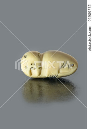Carved Eskimo figurine of a walrus from walrus fang. Carved Eskimo figurine of a walrus from walrus fang. 93989785