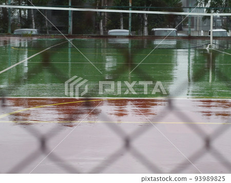 Tennis court wet in the rain Tennis court wet in the rain 93989825