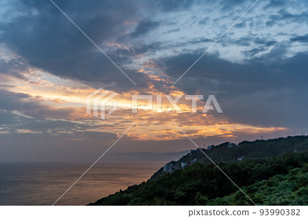 Sunset sky and villa area by the sea 93990382