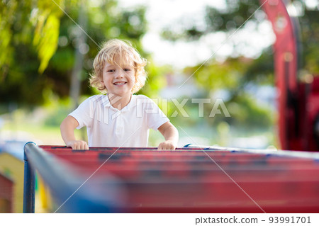 Child on playground. Kids play outdoor. 93991701