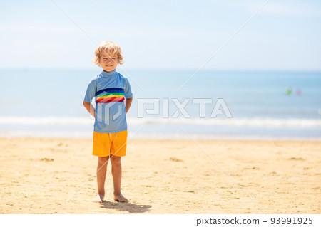 Kids playing on beach. Children play at sea. 93991925