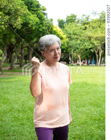 Pleasant entertainment for elderly women in Asia with smiles, full-body relaxation and warm body exercises, enjoying the fresh air of nature in the park. Pleasant entertainment for elderly women in Asia with smiles, full-body relaxation and warm body exercises, enjoying the fresh air of nature in the park. 93992027