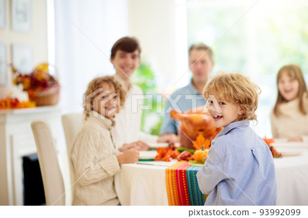 Thanksgiving family dinner. Roasted turkey meal. 93992099