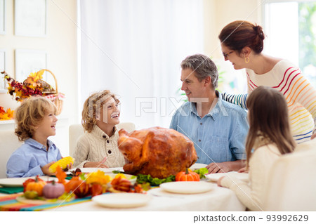Thanksgiving family dinner. Roasted turkey meal. 93992629
