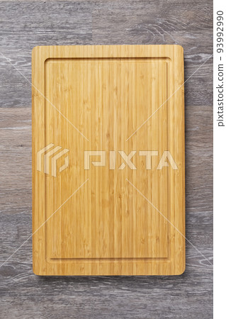 Empty cutting board on the kitchen table 93992990