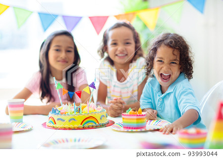 Kids birthday party. Children with cake and gifts 93993044