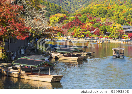 Arashiyama in autumn, a houseboat on a sightseeing boat Arashiyama in autumn, a houseboat on a sightseeing boat 93993808
