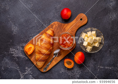 French croissant. Freshly baked croissants with jam butter French croissant. Freshly baked croissants with jam butter 93994656