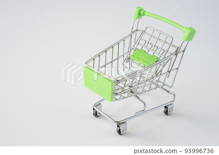 Small shopping cart on gray background. shopping concept Small shopping cart on gray background. shopping concept 93996736
