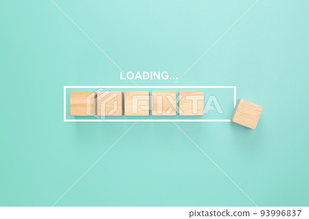 Showing loading bar with wood cube on pastel background. Progress bar made from wooden cubes. Loading. Top view 93996837
