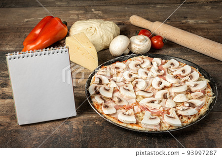 homemade pizza and mockup notepad with recipe pizza on wooden rustic background with ingredients for making pizza homemade pizza and mockup notepad with recipe pizza on wooden rustic background with ingredients for making pizza 93997287