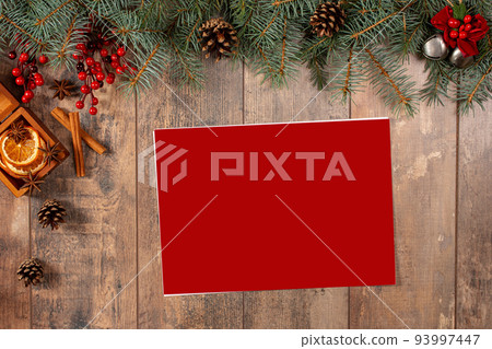 Christmas greeting card, decor and snow fir tree. Top view with space for your xmas wishes. letter to Santa. christmas mockup Christmas greeting card, decor and snow fir tree. Top view with space for your xmas wishes. letter to Santa. christmas mockup 93997447