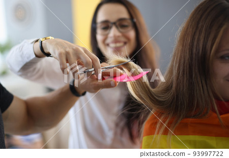 Student in hairdressing is learning how to cut hair 93997722