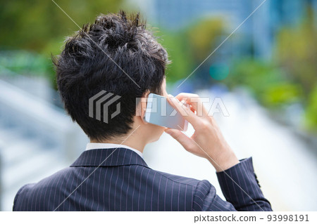 Businessmen using smartphones 93998191