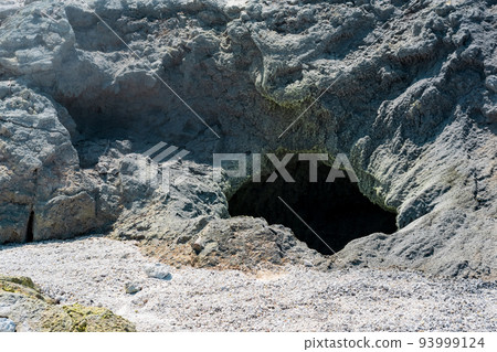 vent of a volcanic fumarole in the ground, covered with crystalline sulfur 93999124