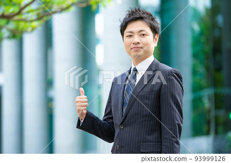 Businessman doing a "good" pose Businessman doing a "good" pose 93999126