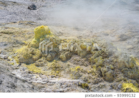 smoking solfatara in a fumarole field on the slope of the Mendeleev volcano smoking solfatara in a fumarole field on the slope of the Mendeleev volcano 93999132