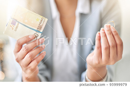 Money, finance or cash and divorce, wedding or ring in the hands of a woman, bride or wife with a decision or choice. Family law with a female leaving a marriage for mental health and holding payment Money, finance or cash and divorce, wedding or ring in the hands of a woman, bride or wife with a decision or choice. Family law with a female leaving a marriage for mental health and holding payment 93999979