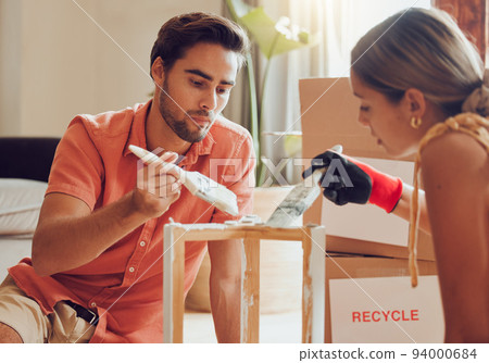 Couple painting or decorate wooden table or chair by recycle and thrift furniture for a home improvement project in apartment. Creative and DIY man and woman with reusable objects in their house Couple painting or decorate wooden table or chair by recycle and thrift furniture for a home improvement project in apartment. Creative and DIY man and woman with reusable objects in their house 94000684