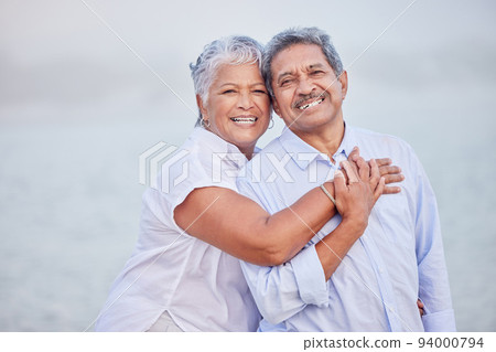 Senior love, hug and portrait couple on beach in trust hug, security and safety on retirement holiday, vacation or break. Happy couple, people smile and elderly man and woman bonding close together Senior love, hug and portrait couple on beach in trust hug, security and safety on retirement holiday, vacation or break. Happy couple, people smile and elderly man and woman bonding close together 94000794