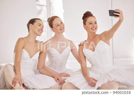 Ballet, dance and selfie on a phone with a ballerina, dancer and perfromance artist in a dancing studio. Smile, photograph and costume with creative and artistic performers in a floor for production 94001038
