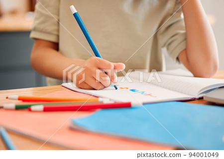 Student drawing picture in book, learning math and doing calculations in a notebook for education in a classroom at school. Little child writing, being creative with numbers and studying in class 94001049