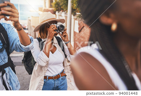 Travel, tourism and photograph with a woman tourist taking a picture while on holiday, vacation or weekend getaway. Memories, sightseeing and overseas with a young female using a camera abroad Travel, tourism and photograph with a woman tourist taking a picture while on holiday, vacation or weekend getaway. Memories, sightseeing and overseas with a young female using a camera abroad 94001448