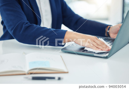 Business person clean laptop with tissue, care for desk and workspace and protect from covid at table in corporate office. Employee, worker and professional cleaning dust from keyboard at work Business person clean laptop with tissue, care for desk and workspace and protect from covid at table in corporate office. Employee, worker and professional cleaning dust from keyboard at work 94003054