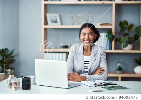 Happy, confident and successful business woman ready to lead startup company and start working on laptop. Proud and powerful CEO or African American entrepreneur sitting at an office desk. Happy, confident and successful business woman ready to lead startup company and start working on laptop. Proud and powerful CEO or African American entrepreneur sitting at an office desk. 94003478