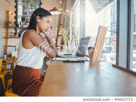 Stressed, thinking and working woman on a laptop at a cafe, watching a video or receiving bad news on a video call. Serious student studying at a coffee shop, reading an email online. 94003753