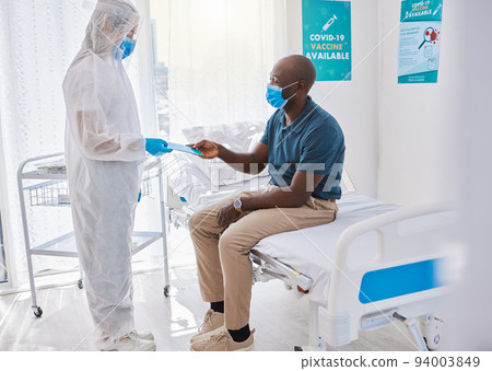 Black man talking to doctor, with covid mask and getting medical wellness advice at hospital or clinic. Expert, professional or healthcare worker helping patient, doing checkup and giving brochure Black man talking to doctor, with covid mask and getting medical wellness advice at hospital or clinic. Expert, professional or healthcare worker helping patient, doing checkup and giving brochure 94003849