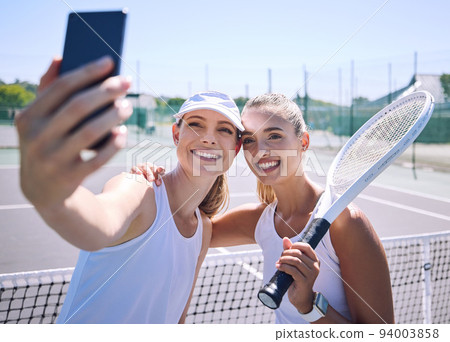 Tennis, selfie and sports women friends on a court in the summer for exercise. Happy, face and smile woman in a sport together in health, fitness and wellness in training workout and motivation. 94003858