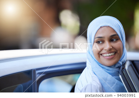 Muslim business woman using car to travel for transport in urban city, thinking of location and happy on work trip. Face of Arab and Islamic worker in taxi cab with smile and working as entrepreneur 94003991