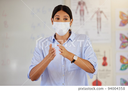 Pandemic, mask and doctor talking at school career presentation or parent and teacher meeting. Covid protocol and restrictions in education for illness protection for staff and children at risk. 94004358