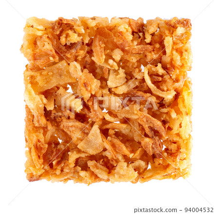 Roasted onions isolated on white background. Crispy fried onions. Top view. Roasted onions isolated on white background. Crispy fried onions. Top view. 94004532