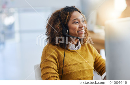 Dont forget to smile. Shot of a female agent working in a call centre. 94004646