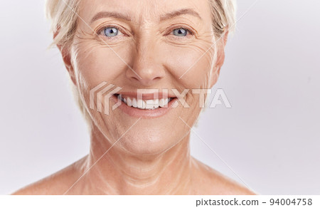 Portrait of a happy senior womans face against studio mockup background. Healthy and natural mature model with smooth skin. Feeling radiant and fresh with her healthcare or skincare cosmetic routine Portrait of a happy senior womans face against studio mockup background. Healthy and natural mature model with smooth skin. Feeling radiant and fresh with her healthcare or skincare cosmetic routine 94004758