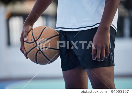 Basketball athlete ready for training, game and competition on sports court from below outdoor. Training, focus and fitness workout black man with motivation, mindset and goal to play, cardio and win Basketball athlete ready for training, game and competition on sports court from below outdoor. Training, focus and fitness workout black man with motivation, mindset and goal to play, cardio and win 94005197