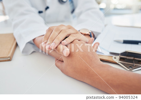 Hands, support and trust with a doctor and patient in the hospital for consulting, healthcare and medicine. Medical, care and help with a medicare professional and a victim in a clinic for health 94005324