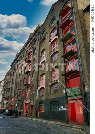 Old warehouses turned residential flats in the docklands, London, UK. Old warehouses turned residential flats in the docklands, London, UK. 94005653