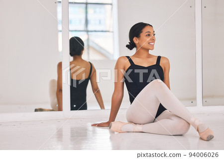 Ballet, ballerina and dancer sitting on floor during break and rest from dancing beautiful, elegant or classical choreography. Smiling professional performer in dance studio after practicing routine Ballet, ballerina and dancer sitting on floor during break and rest from dancing beautiful, elegant or classical choreography. Smiling professional performer in dance studio after practicing routine 94006026