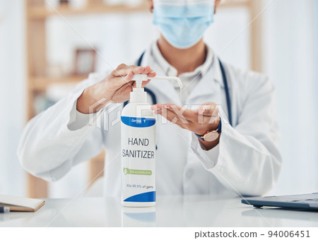 Covid, hand sanitizer and hygiene with doctor, pharmacist or medical healthcare professional with a face mask. Health, insurance and consulting in hospital, clinic or office with expert behind desk Covid, hand sanitizer and hygiene with doctor, pharmacist or medical healthcare professional with a face mask. Health, insurance and consulting in hospital, clinic or office with expert behind desk 94006451