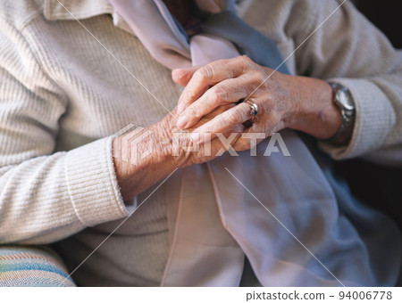 Elderly woman hands clasped retirement concept Elderly woman hands clasped retirement concept 94006778
