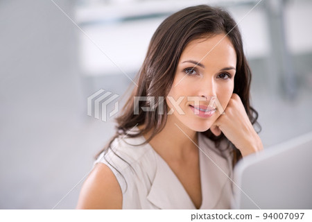 Smiling woman with a computer thinking, brainstorming and planning creative property marketing advertisement or social media post on new house. Portrait of confident real estate agent in office alone Smiling woman with a computer thinking, brainstorming and planning creative property marketing advertisement or social media post on new house. Portrait of confident real estate agent in office alone 94007097