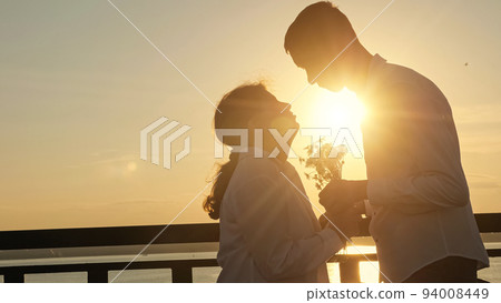 Young disabled couple holds hands showing pure love closeup Young disabled couple holds hands showing pure love closeup 94008449